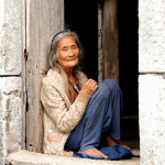 An 85-year old Ivatan woman sitting at her house door 