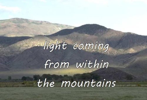 12-12 light coming from within the mountains
